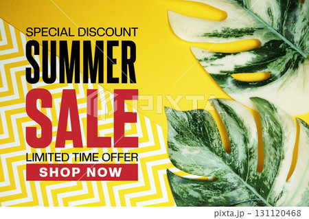 Summer Sale text with monstera leaf on yellow background 131120468