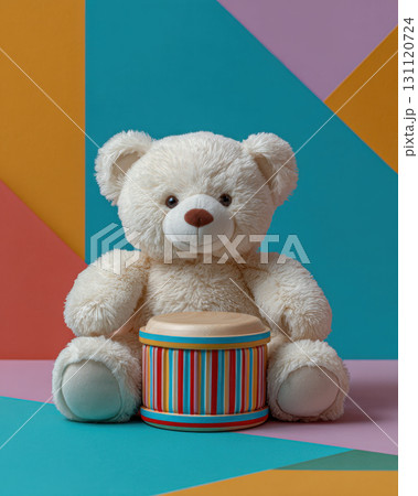 Soft teddy bear holding striped drum, perfect for celebrating Kwanzaa for children with joy and creativity 131120724