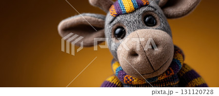 Cute stuffed donkey toy wearing knitted scarf and hat, perfect for kwanzaa celebrations for children 131120728