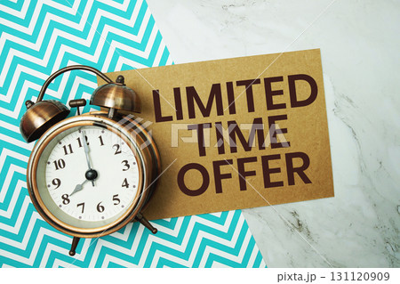 Limited Time Offer text with alarm clock on marble background Limited Time Offer text with alarm clock on marble background 131120909