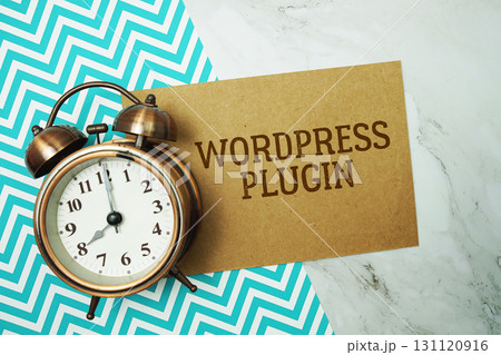 WordPress Plugin text written on paper card with alarm clock on marble background WordPress Plugin text written on paper card with alarm clock on marble background 131120916