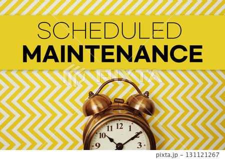 Scheduled Maintenance text with alarm clock on yellow background Scheduled Maintenance text with alarm clock on yellow background 131121267