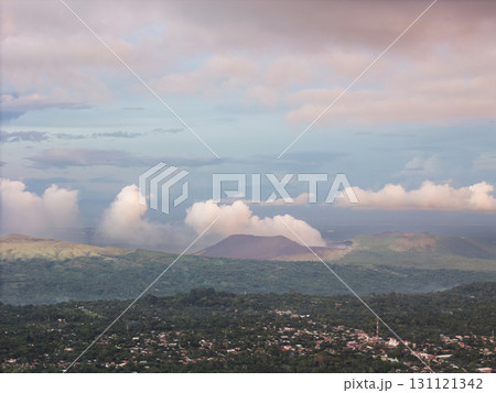 Scenic view of volcanic landscape under cloudy sky Scenic view of volcanic landscape under cloudy sky 131121342