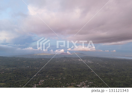 Sunset over lush hills and clouds in countryside 131121343