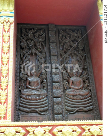 An Intricately Carved Wooden Temple Door with Meditating Figures and Floral Designs 131121714