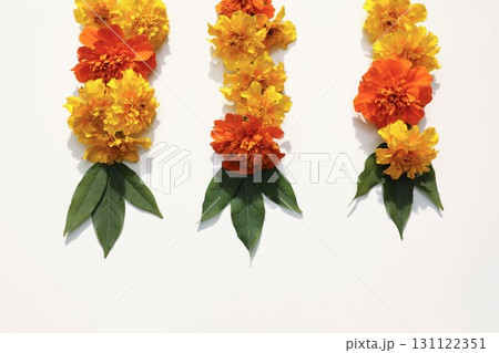 Indian floral garland with yellow orange marigold zendu flowers, green leaves isolated on transparent background. Diwali, weddings, pooja, religious hindu festivals and Day of the Dead decor. 131122351