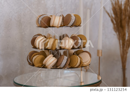 Delicious Chocolate Caramel Macarons Tier Display: Sweets, Pastries, Dessert, Beige and Brown Colors, Elegant Stand, Food Photography Style 131123254
