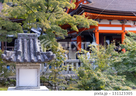 Traditional stone lantern in Kyoto Kiyomizu dera temple with soft focus architecture and foliage Traditional stone lantern in Kyoto Kiyomizu dera temple with soft focus architecture and foliage 131123305