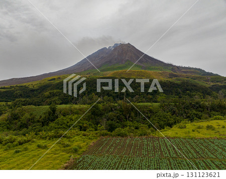 Aerial view of mount Sinabung volcano, on the island of Sumatra, Indonesia. Aerial view of mount Sinabung volcano, on the island of Sumatra, Indonesia. 131123621