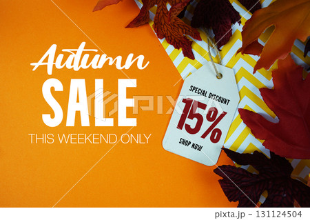 Autumn Sale 15% Off with Price Tag and maple leaf decorated on orange background Autumn Sale 15% Off with Price Tag and maple leaf decorated on orange background 131124504