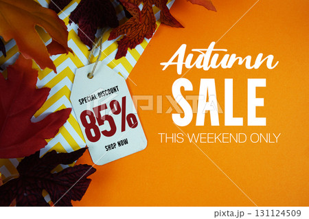 Autumn Sale 85% Off with Price Tag and maple leaf decorated on orange background Autumn Sale 85% Off with Price Tag and maple leaf decorated on orange background 131124509