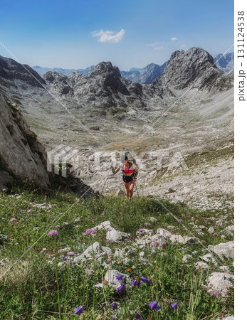 Young Woman Hiking in Albanian Alps Mountains Young Woman Hiking in Albanian Alps Mountains 131124538