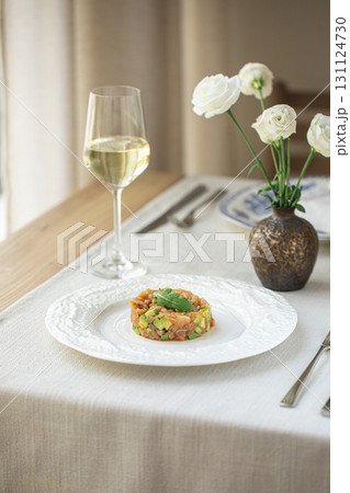 Salmon tartare with avocado and a glass of wine Salmon tartare with avocado and a glass of wine 131124730