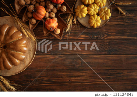Autumn Harvest Table with Bundt Cake, Pumpkin Cookies and Seasonal Decor 131124845