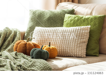 Cozy Autumn Sofa with Fabric Pumpkins and Textured Pillows 131124863