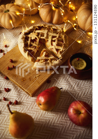 Autumn Pie Bakeout With Lattice Crust, Pumpkins, Fruits, And Cozy Fairy Lights 131124890