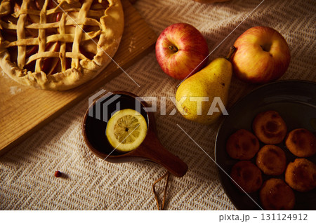 Autumn Harvest Table With Lattice Pie, Apples, Pears, Lemon Cup, And Dumplings 131124912