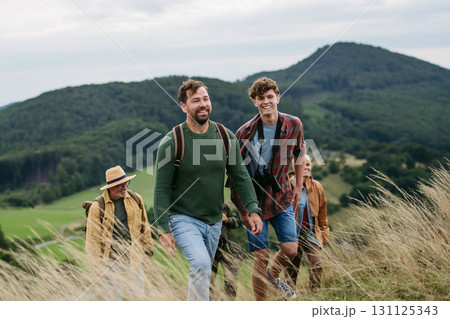 Multigenerational family on hiking trip in nature. Multigenerational family on hiking trip in nature. 131125343