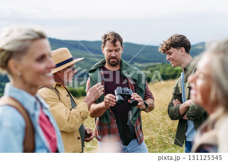 Multigenerational family on hiking trip in nature. 131125345