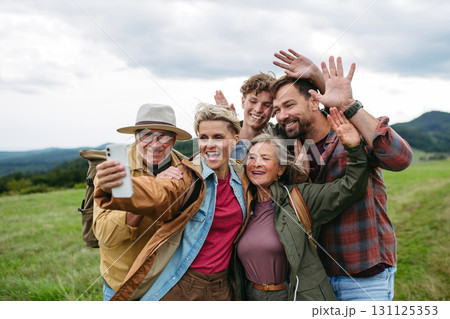 Family taking selfie on hiking trip in the nature. 131125353