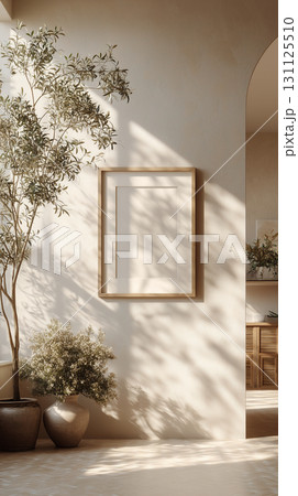 Vertical mockup of blank canvas or picture frame for big square poster in white minimalistic interior. Empty room for exhibition. With warm sunny light. 131125510