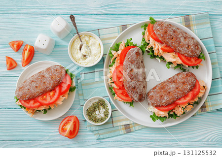 rye bread sandwiches with grilled salmon, veggies rye bread sandwiches with grilled salmon, veggies 131125532