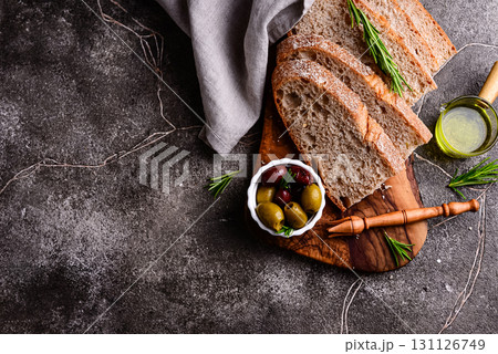 Fresh bread, olive oil and mix of olives. Fresh bread, olive oil and mix of olives. 131126749