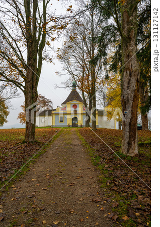 A scenic view of the Chapel of St. Mary of Sorrows at the summit of Krizovy vrch, near Cesky Krumlov, surrounded by nature, offering a peaceful and spiritual atmosphere 131127142