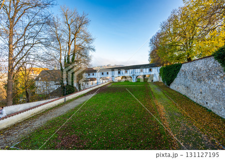 Covered bridge from Cesky Krumlov Castle leading into the park, arching over a narrow alley. The historic structure adds a touch of charm to the peaceful surroundings Covered bridge from Cesky Krumlov Castle leading into the park, arching over a narrow alley. The historic structure adds a touch of charm to the peaceful surroundings 131127195