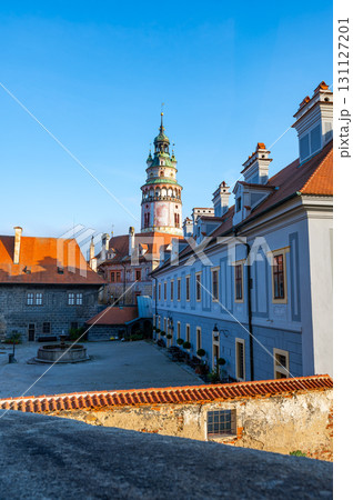 View of the Cesky Krumlov Castle tower and its courtyard. The historic architecture and charming surroundings create a captivating scene of this UNESCO-listed landmark View of the Cesky Krumlov Castle tower and its courtyard. The historic architecture and charming surroundings create a captivating scene of this UNESCO-listed landmark 131127201
