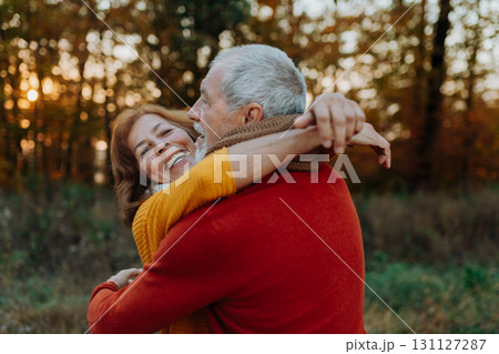 Romantic moment between senior couple, standing in autumn nature. Romantic moment between senior couple, standing in autumn nature. 131127287