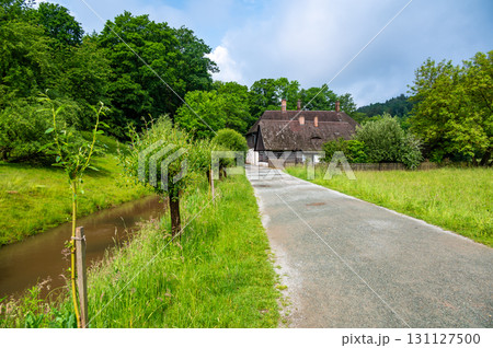 The Old Grandmother's House in Babiccino Valley is a charming historical cottage surrounded by lush greenery, blooming meadows, and the serene Upa River, embodying the essence of Bozena Nemcova's The Old Grandmother's House in Babiccino Valley is a charming historical cottage surrounded by lush greenery, blooming meadows, and the serene Upa River, embodying the essence of Bozena Nemcova's 131127500