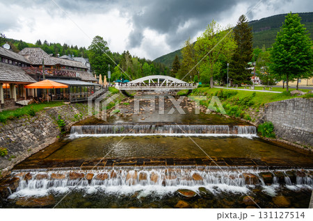 Famous white bridge over Elbe river at Spindleruv Mlyn city, Czech Republic. Famous tourist destination. 131127514