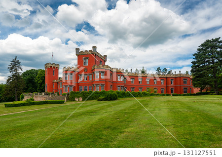 Romantic castle with red facade. Hradek u Nechanic. Czech Republic. Nechanice. Panoramic exterior view. Romantic castle with red facade. Hradek u Nechanic. Czech Republic. Nechanice. Panoramic exterior view. 131127551