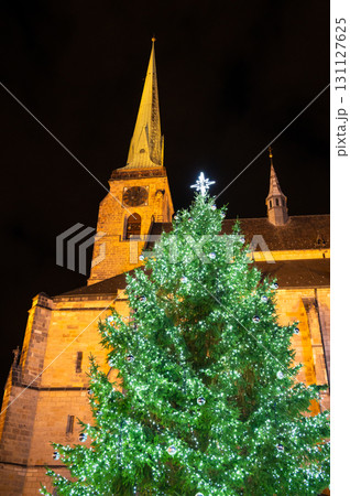 A festive scene with Christmas decorations in the foreground and the Cathedral of St. Bartholomew in Plzen, Czech Republic, in the background. A charming mix of tradition and holiday spirit 131127625