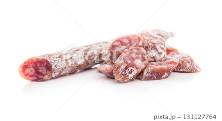 Sliced fuet sausage with mold isolated on white background. 131127764
