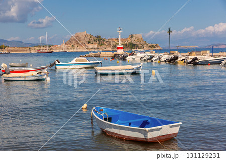 Boats in marina with view of Old Fortress in Corfu Greece on sunny day Boats in marina with view of Old Fortress in Corfu Greece on sunny day 131129231