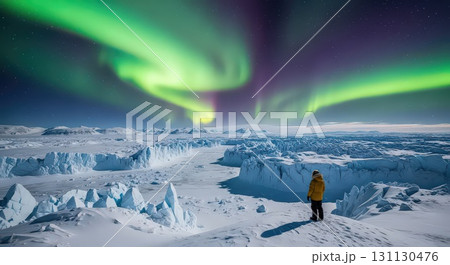 Person Admiring Northern Lights Over Icy Landscape - Generative Ai 131130476