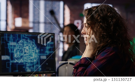 Startup employee shocked after successfully launching on stock market, generating high investment returns. Tech venture manager surprised after securing funding for pioneering software, camera B 131130727