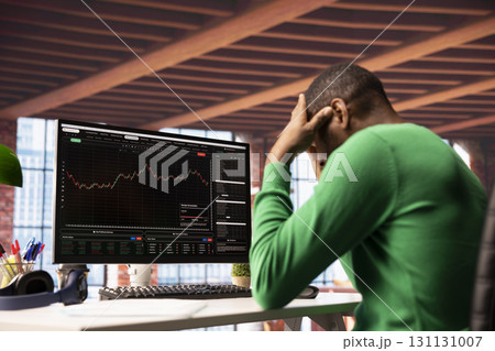 Upset investor dejected after losing money in cryptocurrency investment scam due to rug pull. Sad person in front of PC screen upset by financial loss after trading risky digital asset Upset investor dejected after losing money in cryptocurrency investment scam due to rug pull. Sad person in front of PC screen upset by financial loss after trading risky digital asset 131131007