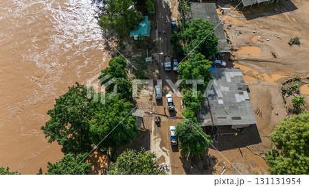 Aerial view of Karen Ruammit Elephant Camp village in Chiang Rai province of Thailand flooded by Kok river after heavy raining. Aerial view of Karen Ruammit Elephant Camp village in Chiang Rai province of Thailand flooded by Kok river after heavy raining. 131131954