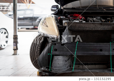 Checking car body work fiber bumper at car garage Checking car body work fiber bumper at car garage 131132295