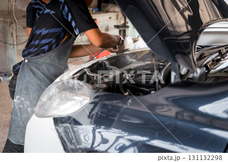 Checking car body work fiber bumper at car garage 131132298