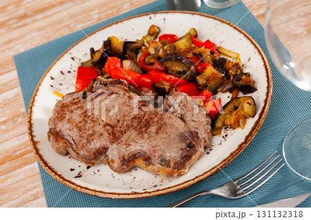 Beef steak with eggplant vegetable saute with bell pepper, onion and tomatoes Beef steak with eggplant vegetable saute with bell pepper, onion and tomatoes 131132318