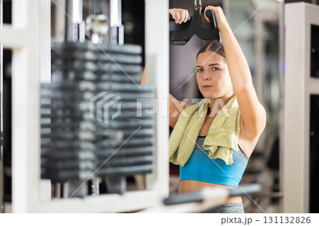 Woman doing back exercise Woman doing back exercise 131132826