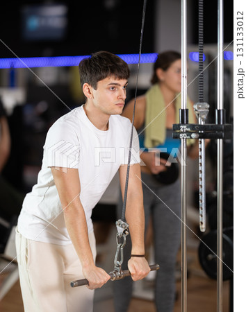 Guy doing arm exercises Guy doing arm exercises 131133012