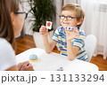 Child Learning Colors with Flashcards in Educational Setting 131133294