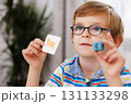 Young Boy Learning with Flashcards and Alphabet Blocks 131133298