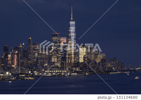 Lower Manhattan illuminated at night with Hudson River on a foreground Lower Manhattan illuminated at night with Hudson River on a foreground 131134680