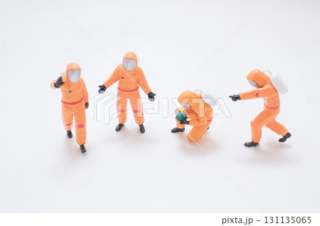 Miniature Orange Astronaut Figures Exploring Space Scene 131135065